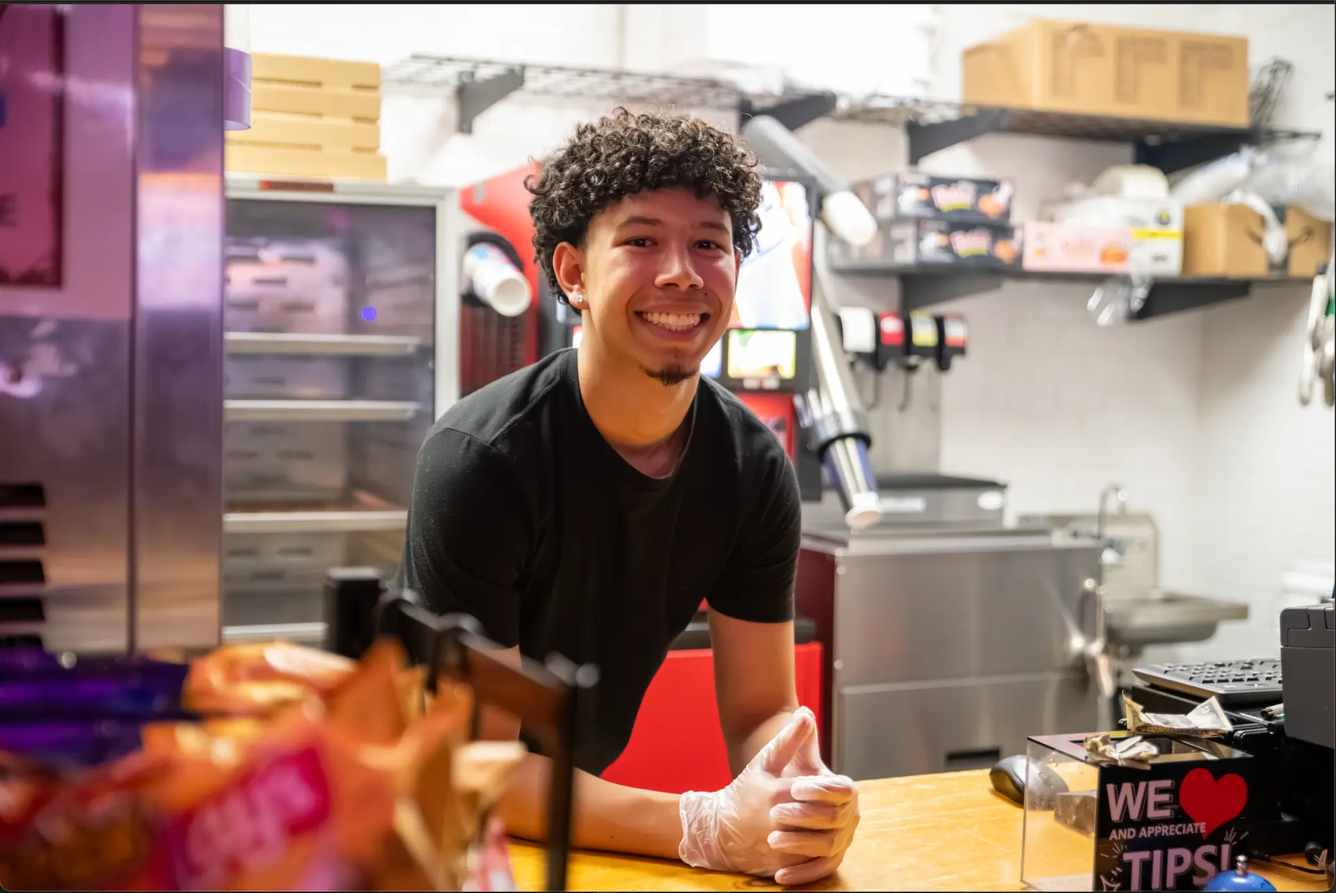 Friendly Spin City staff member at the snack counter